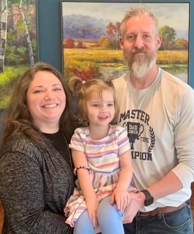 Andrea Beaudry, her daughter, and her husband. 